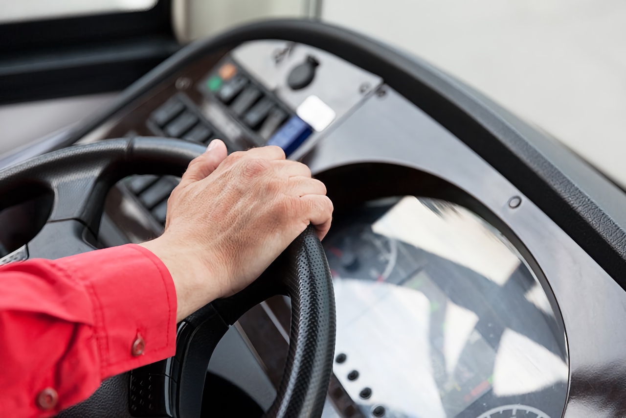 hand on steering wheel