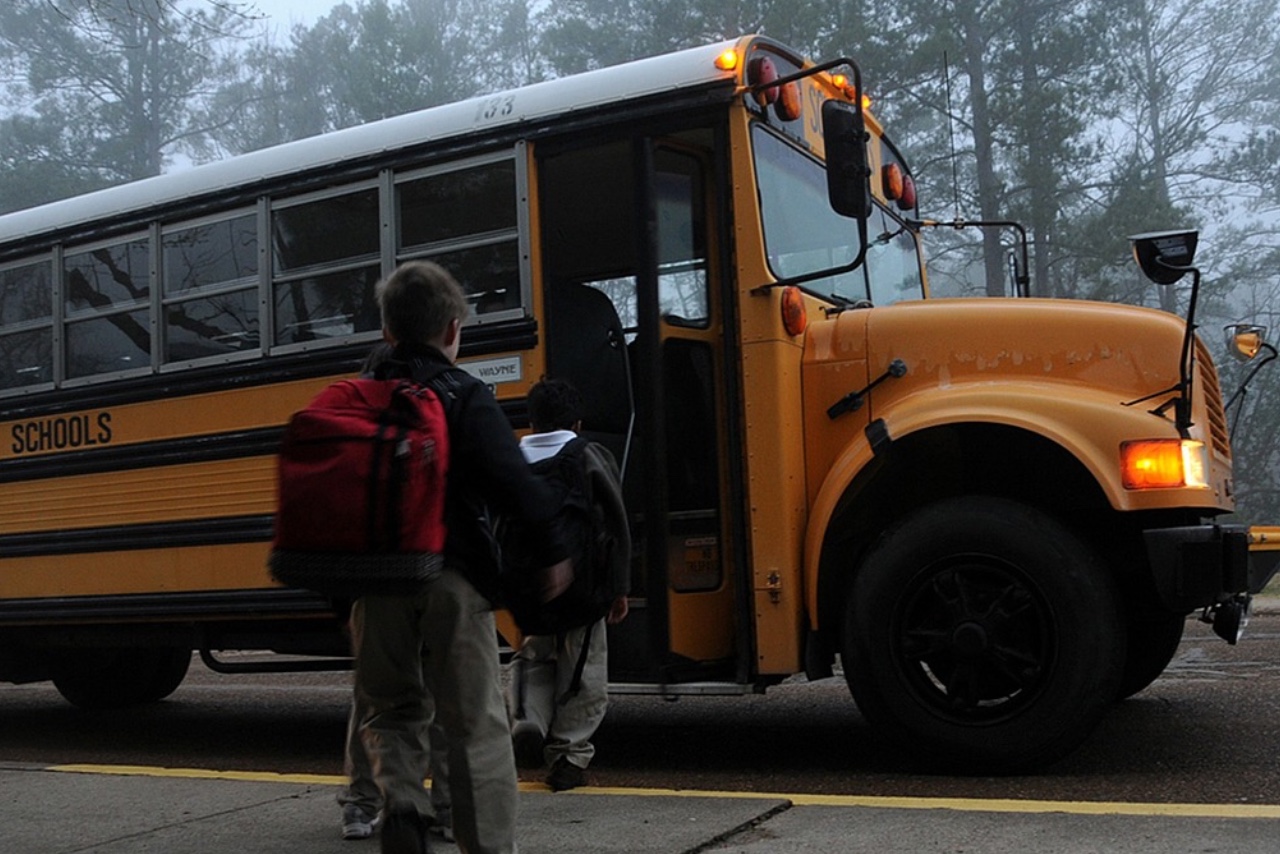 students boarding school bus